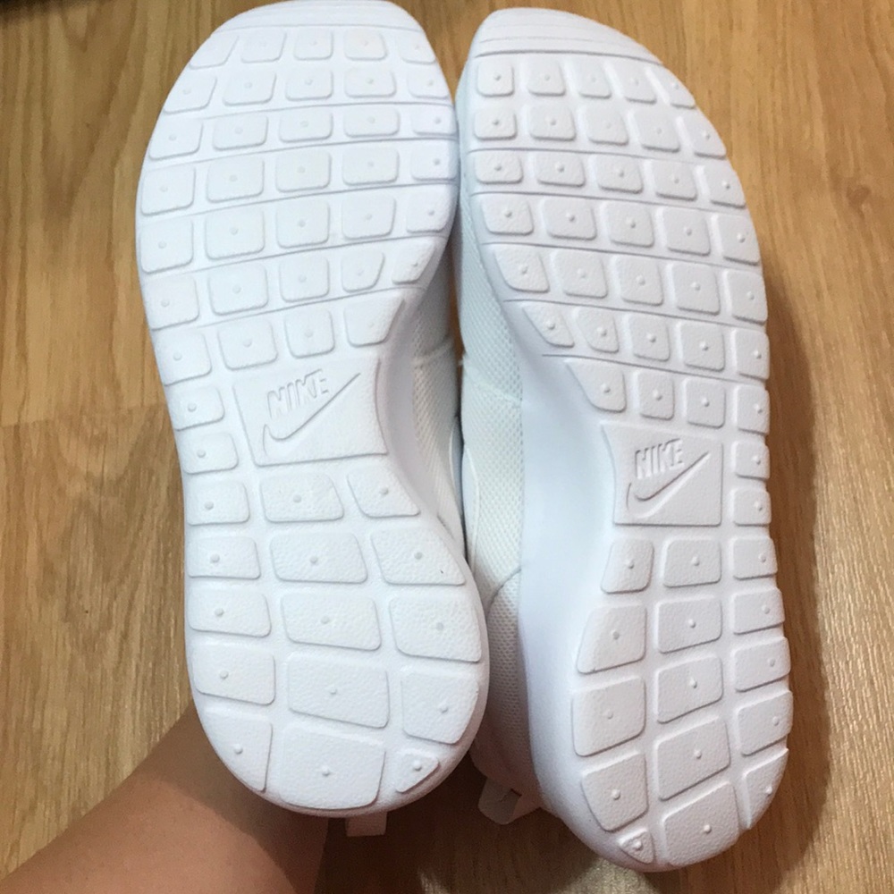 All white Nike Roshe One
